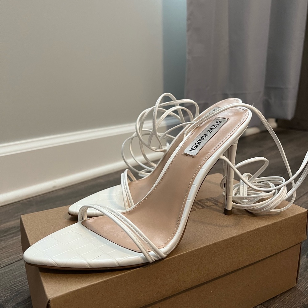 White lace up Steve Madden heels.